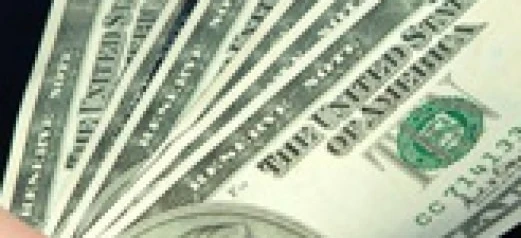 Close-up of a dollar bill with intricate designs. Money handling, saving, and currency concept. Hard limit 125 characters.