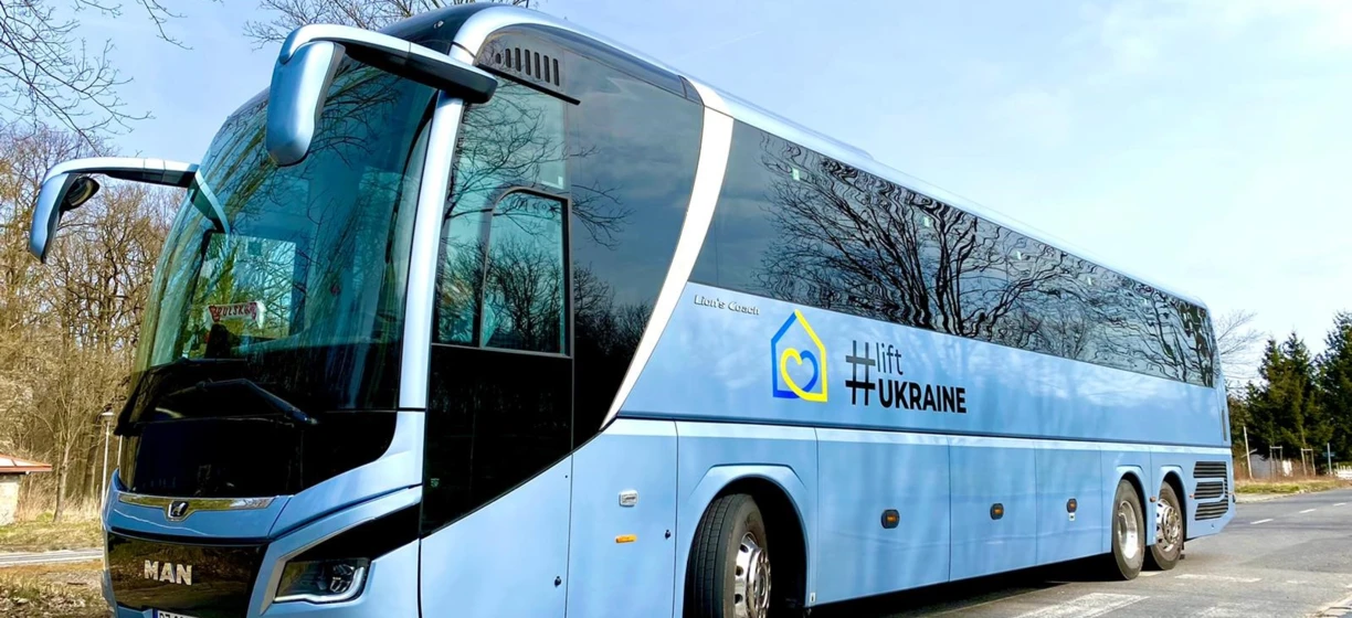 A commercial MAN tour bus with windscreen wipers travels as a mode of public transport in Ukraine. MAN PZ 903VT Lion's Coach Hlift.