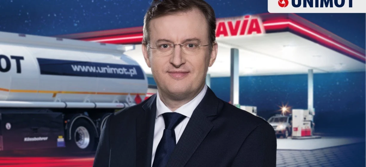 Reklama pojazdu użytkowego przedstawiająca ciężarówkę od UNIMOT z logo Kassbohrer i AVIA. Promocja zrównoważonych rozwiązań transportowych.